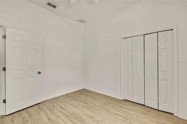 11257 Frigate Bird Ave, Weeki Wachee, FL 34613 - unfurnished bedroom featuring light wood finished floors, a closet, and a ceiling fan