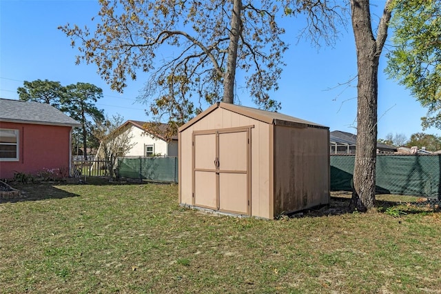 view of shed featuring a fenced backyard