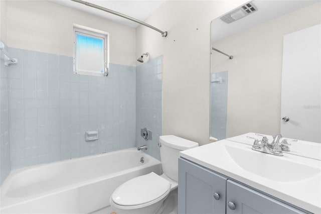 bathroom featuring toilet, tub / shower combination, vanity, and visible vents