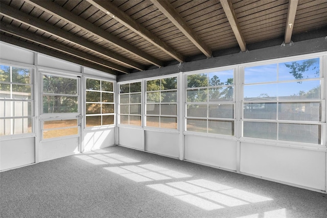 unfurnished sunroom featuring wood ceiling and lofted ceiling with beams