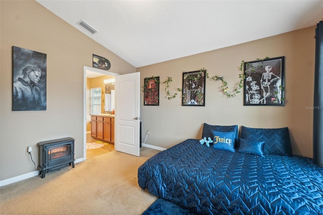 bedroom featuring visible vents, light carpet, lofted ceiling, baseboards, and a wood stove