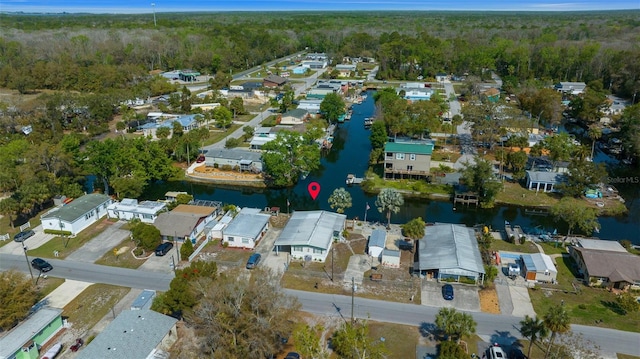 bird's eye view with a forest view, a residential view, and a water view