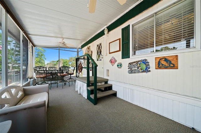 sunroom with a ceiling fan