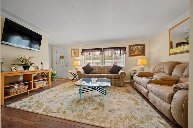 living room with crown molding, baseboards, and wood finished floors