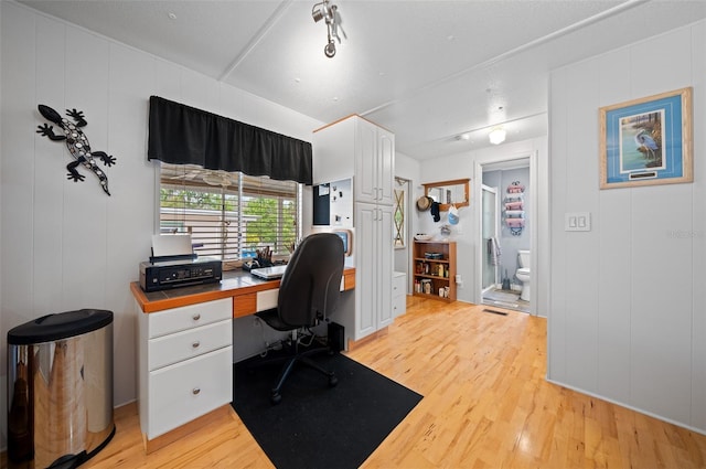 office area featuring visible vents and light wood-type flooring