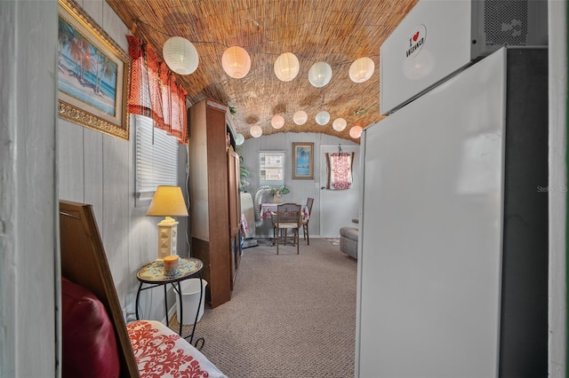 living area featuring lofted ceiling, carpet, and wood ceiling