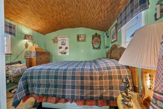 bedroom featuring lofted ceiling and wooden ceiling