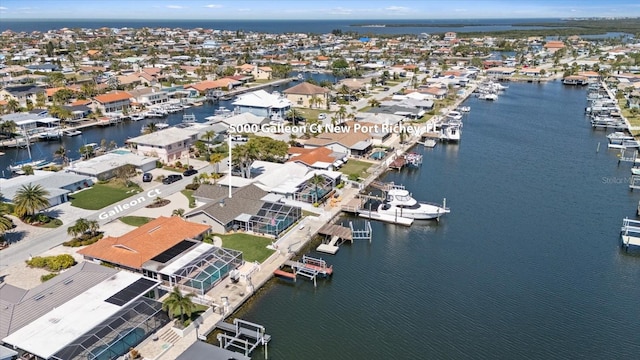 birds eye view of property with a residential view and a water view