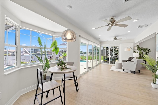 5000 Galleon Ct, New Port Richey, FL 34652 - sunroom / solarium with plenty of natural light, wood finished floors, a textured ceiling, and recessed lighting