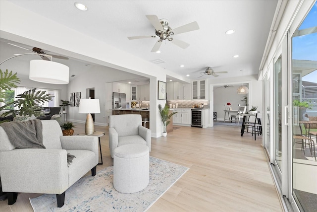 5000 Galleon Ct, New Port Richey, FL 34652 - living area featuring wine cooler, recessed lighting, ceiling fan, and light wood-style floors