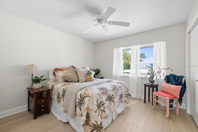5000 Galleon Ct, New Port Richey, FL 34652 - bedroom featuring light wood-style flooring, a closet, and ceiling fan