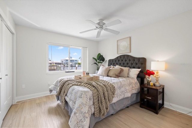 5000 Galleon Ct, New Port Richey, FL 34652 - bedroom with wood finished floors, a closet, and ceiling fan