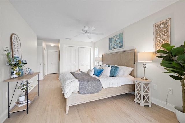 5000 Galleon Ct, New Port Richey, FL 34652 - bedroom with light wood-style floors, ceiling fan, and multiple closets