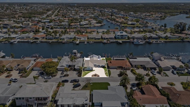 5000 Galleon Ct, New Port Richey, FL 34652 - aerial view of property and surrounding area with nearby suburban area and a large body of water