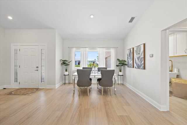 5000 Galleon Ct, New Port Richey, FL 34652 - dining room featuring light wood-style floors and recessed lighting