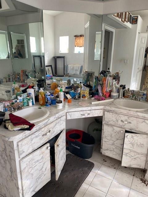 bathroom featuring tile patterned floors and vanity