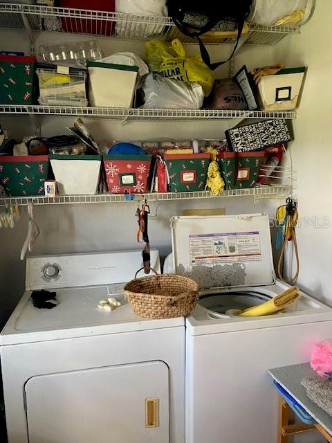 clothes washing area featuring laundry area and independent washer and dryer