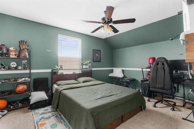 carpeted bedroom with ceiling fan and lofted ceiling