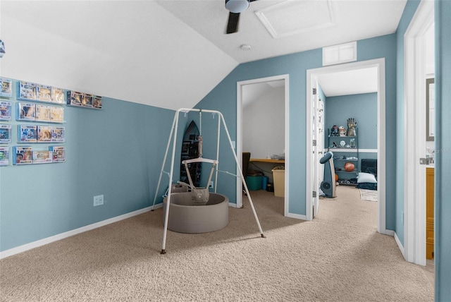 carpeted bedroom featuring visible vents, ceiling fan, baseboards, and lofted ceiling