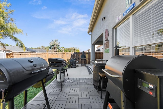 view of patio / terrace with area for grilling and a fenced backyard