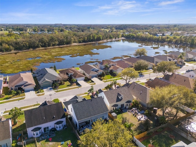 birds eye view of property with a residential view and a water view