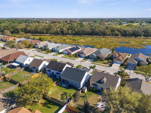 birds eye view of property with a residential view and a water view