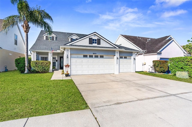 view of front of property featuring stucco siding, a front lawn, roof with shingles, concrete driveway, and an attached garage