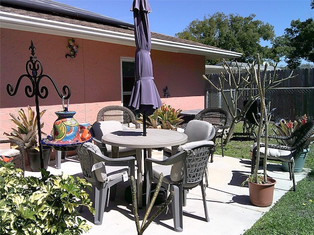 view of patio / terrace with fence and outdoor dining area