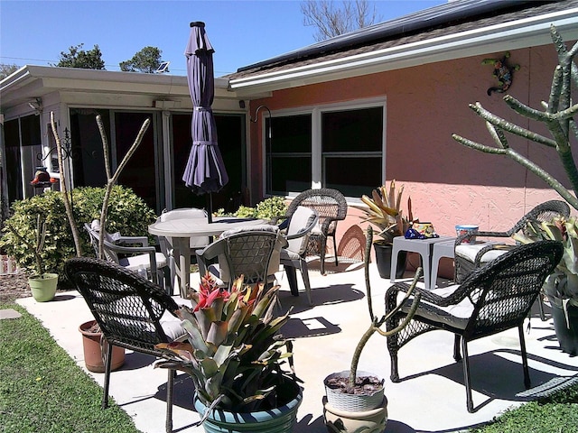 view of patio featuring outdoor dining area