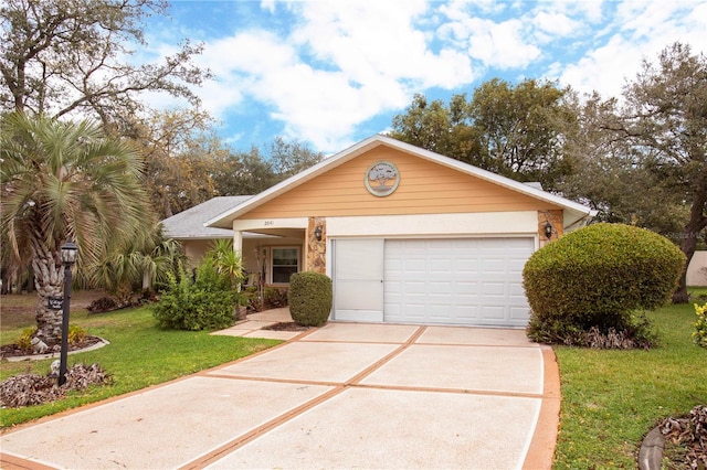 view of front of home featuring driveway, an attached garage, and a front lawn