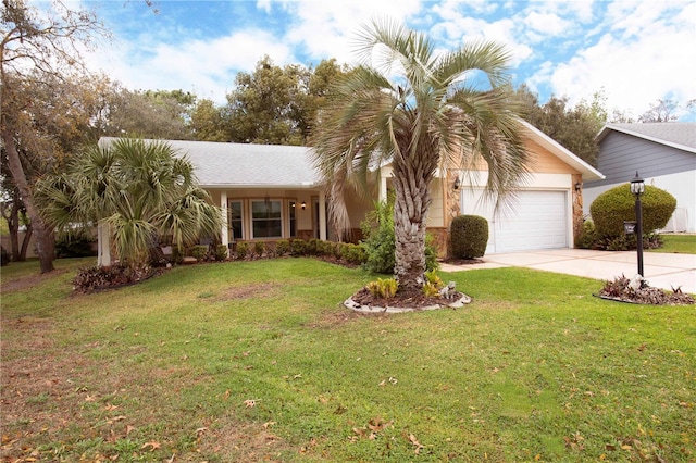 view of front of property with driveway, an attached garage, and a front yard