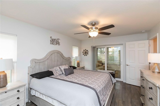 bedroom with dark wood-style flooring, a ceiling fan, and access to exterior