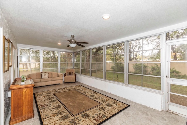 sunroom featuring a ceiling fan