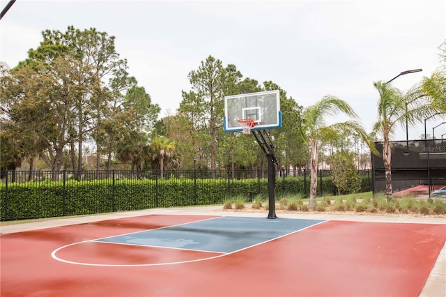 view of sport court featuring community basketball court and fence