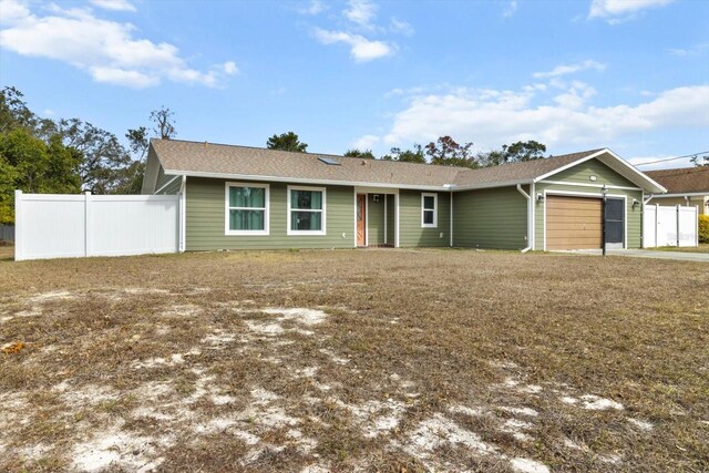 5441 Alderwood St, Spring Hill, FL 34606 - ranch-style home with fence and an attached garage