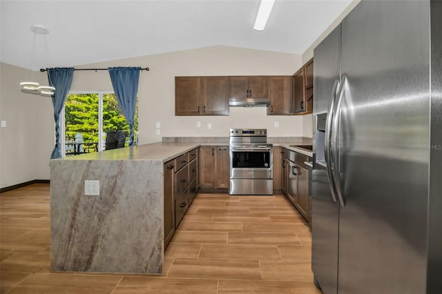 kitchen featuring under cabinet range hood, a peninsula, appliances with stainless steel finishes, and wood tiled floor