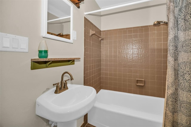 bathroom featuring shower / tub combo and a sink