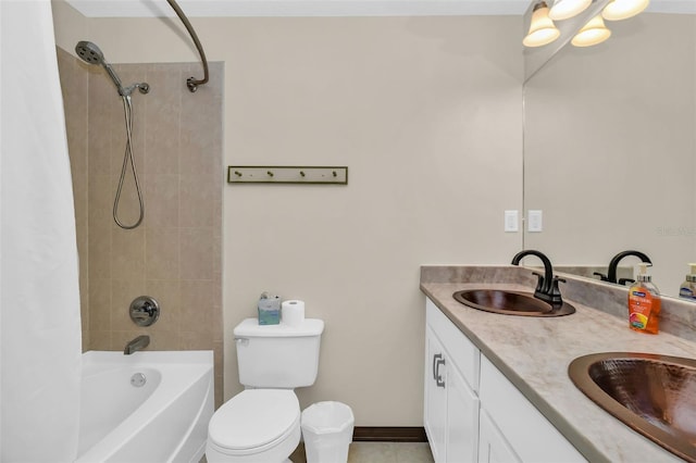 bathroom with a sink, shower / bath combo with shower curtain, toilet, and double vanity