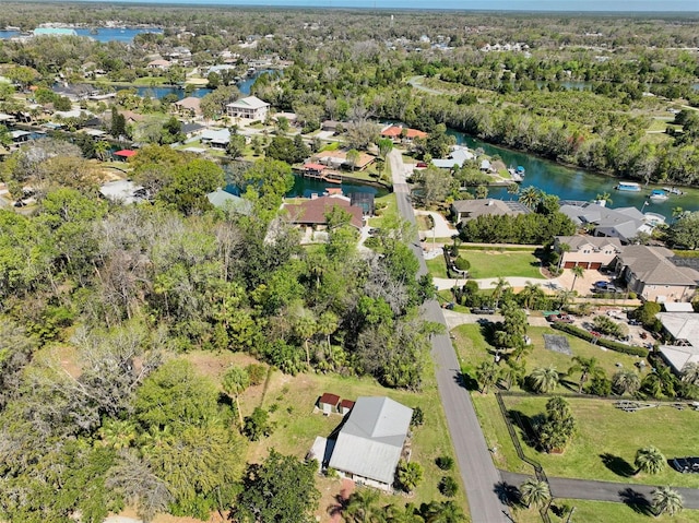 drone / aerial view featuring a residential view and a water view