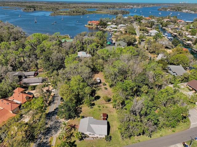 birds eye view of property with a residential view and a water view