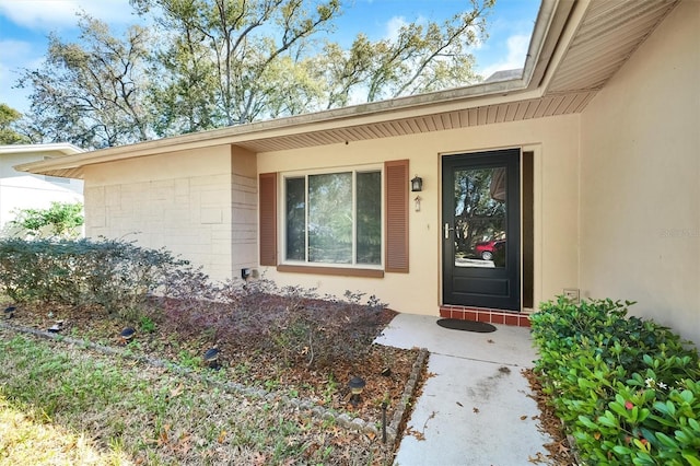 8420 Winding Wood Dr, Port Richey, FL 34668 - view of exterior entry featuring stucco siding