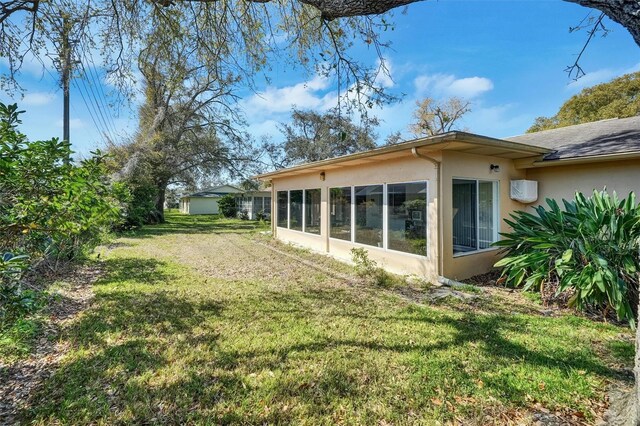 8420 Winding Wood Dr, Port Richey, FL 34668 - view of yard with a sunroom