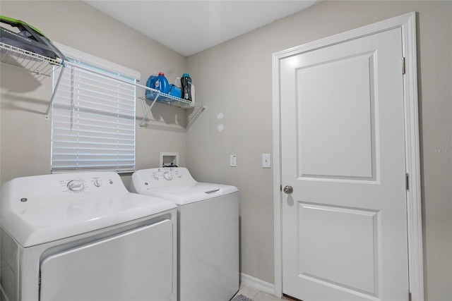 washroom featuring laundry area and separate washer and dryer