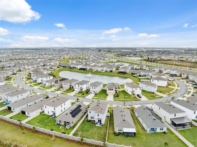 birds eye view of property with a residential view and a water view