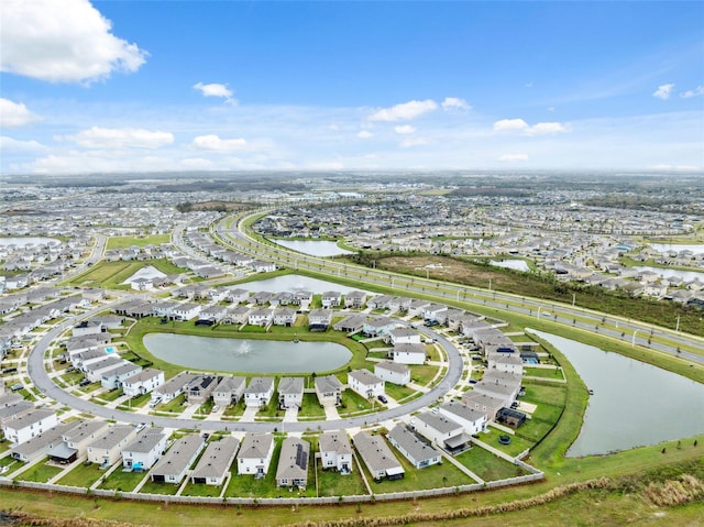 birds eye view of property featuring a water view and a residential view