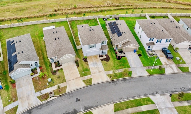 birds eye view of property with a residential view