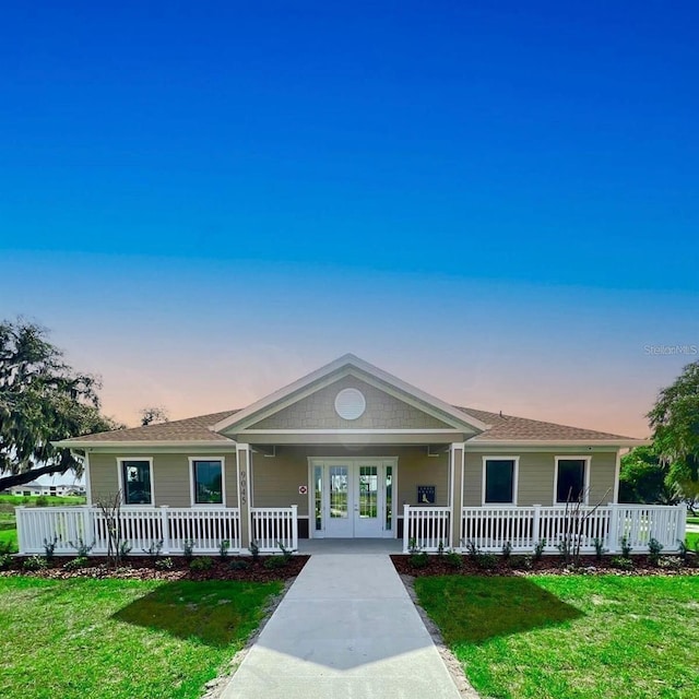 view of front of house featuring a yard and a porch