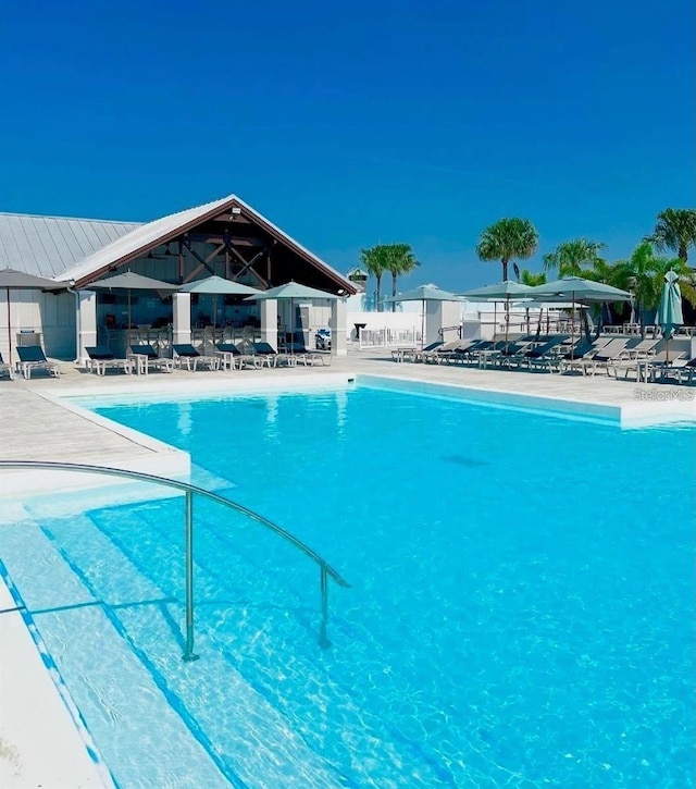 community pool with a patio area