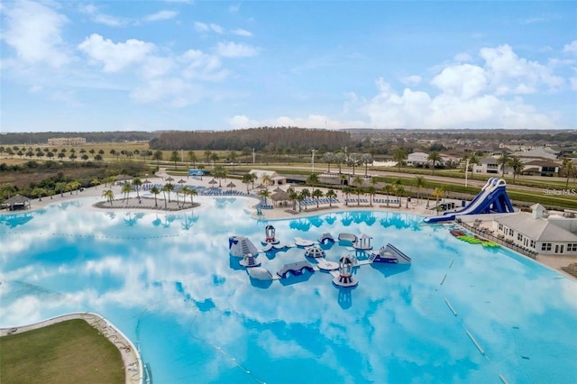 view of pool with a water slide