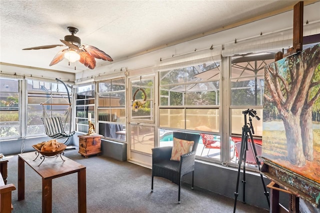 sunroom with ceiling fan